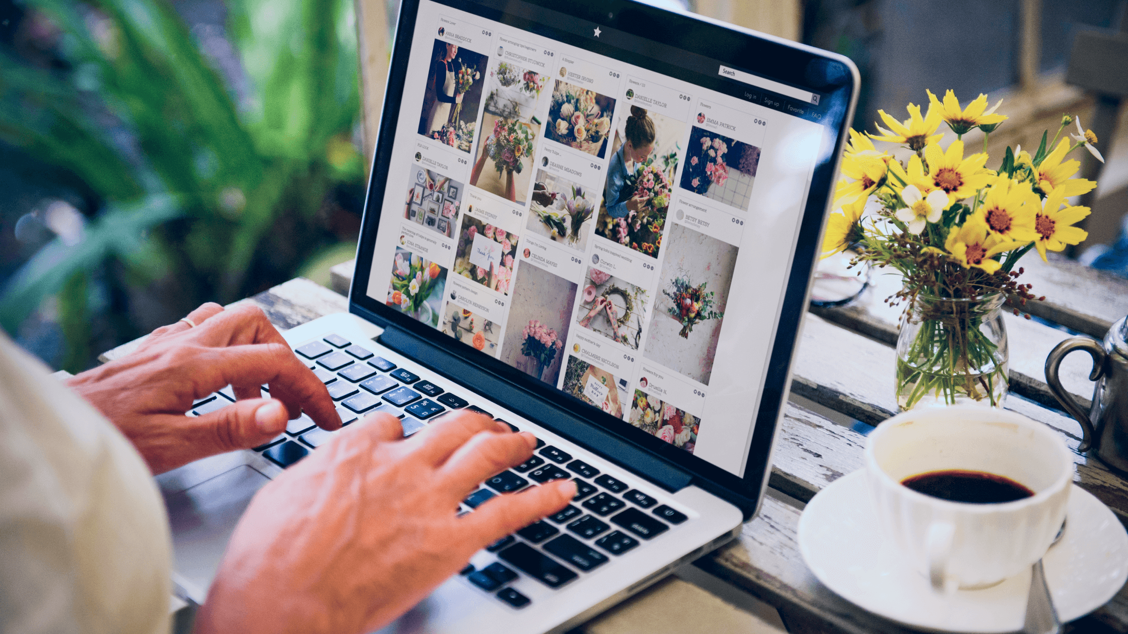 A woman searching for flower arrangement inspirations online