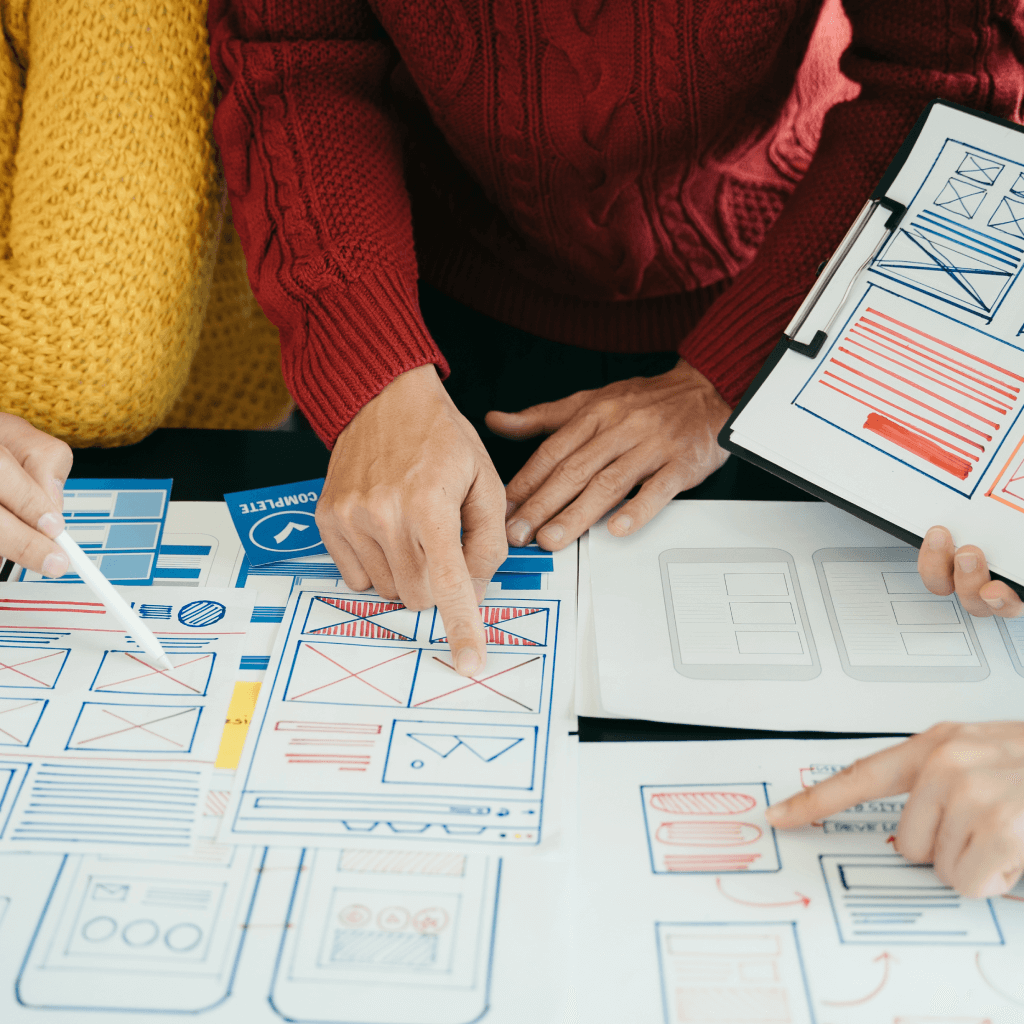 SEO Web Designers discussing website wireframe