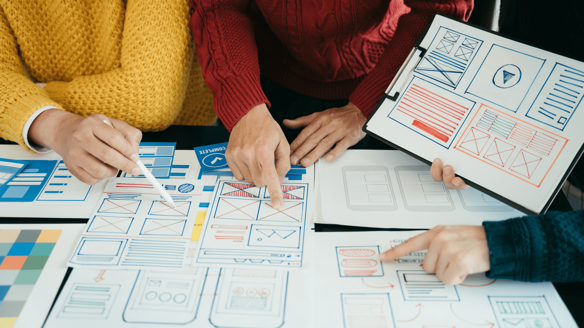 SEO Web Designers discussing website wireframe
